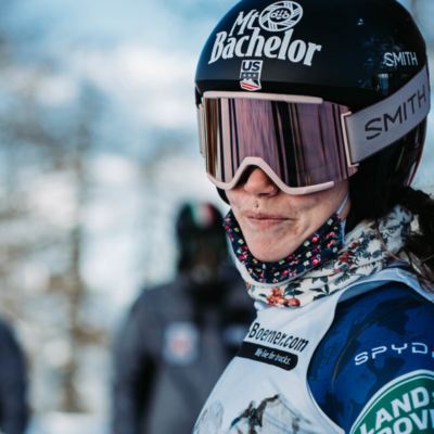 Skiier Laurenne Ross smiling with her ski goggles and helmet on