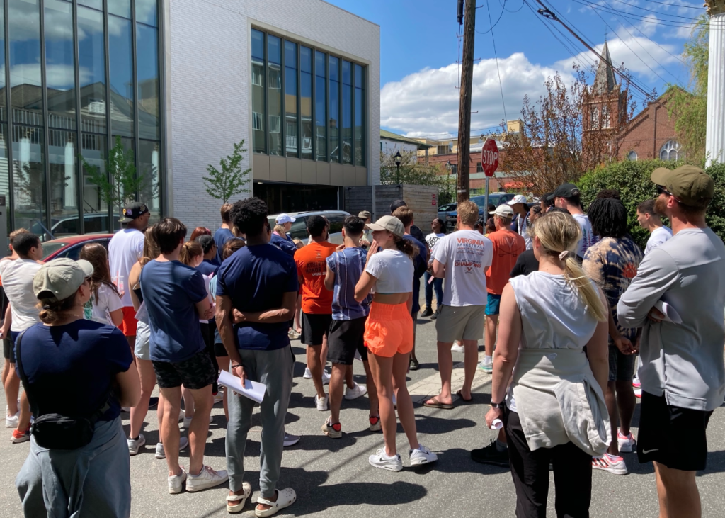 a group of UVA students stand in a street