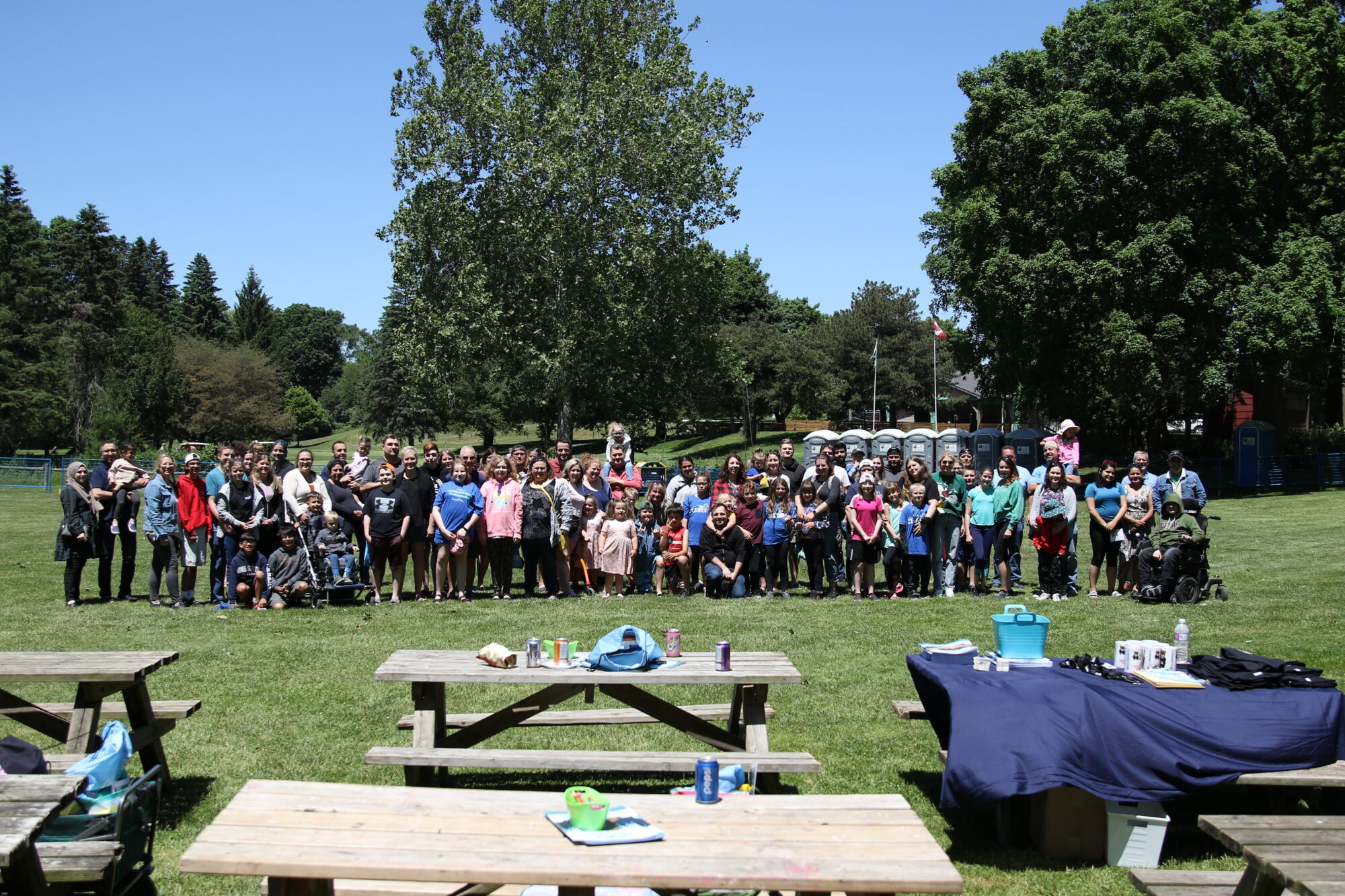 A large group posing together standing on a field