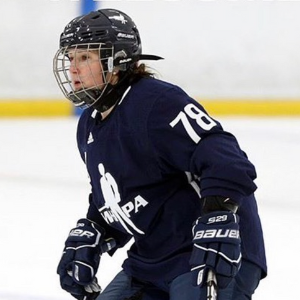 Former hockey player Anissa Gamble wearing her gear out on the ice.