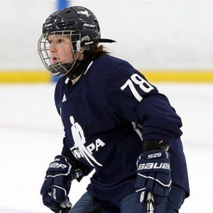 Former hockey player Anissa Gamble wearing her gear out on the ice. 