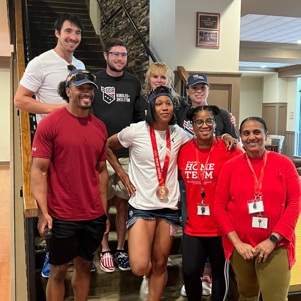 Members of USABS smile and pose for a photo with staff members at the Ronald McDonald House of Charities of Greater Charlotte.