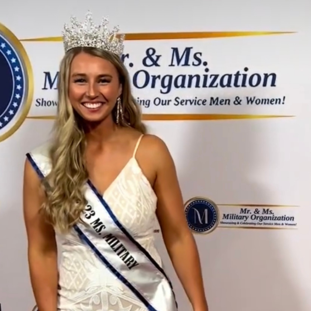 Photo of Riley Tejeck wearing Miss Military 2023 sash and crown, smiling.