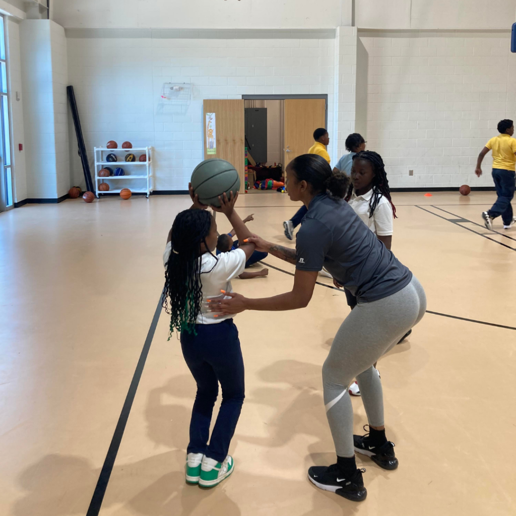 Zion Walters teaching a basketball clinic at the Boys & Girls Club.