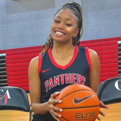 Headshot of Zion Walters holding a basketball