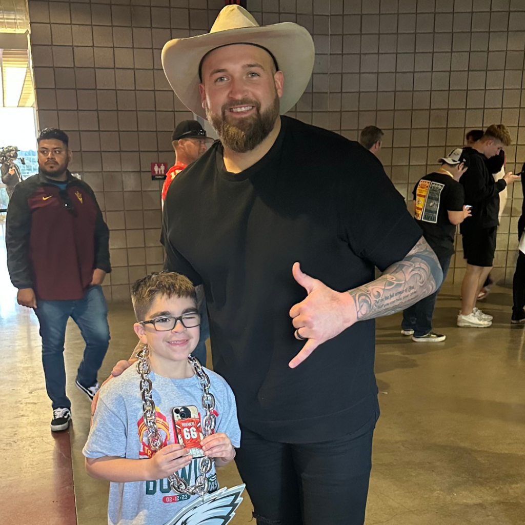Dalton poses for a photo at the SuperBowl in Arizona with Eastyn.