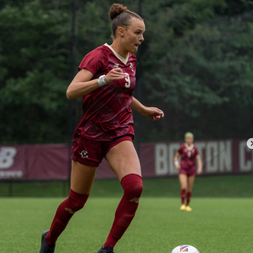 Boston College soccer player Sydney Segalla photographed juggling a soccer ball during a match.