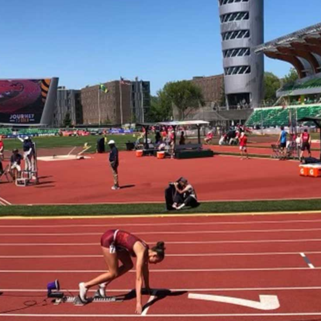 Sydney Segalla is photographed on the track in lane 7 as she gets set to run.