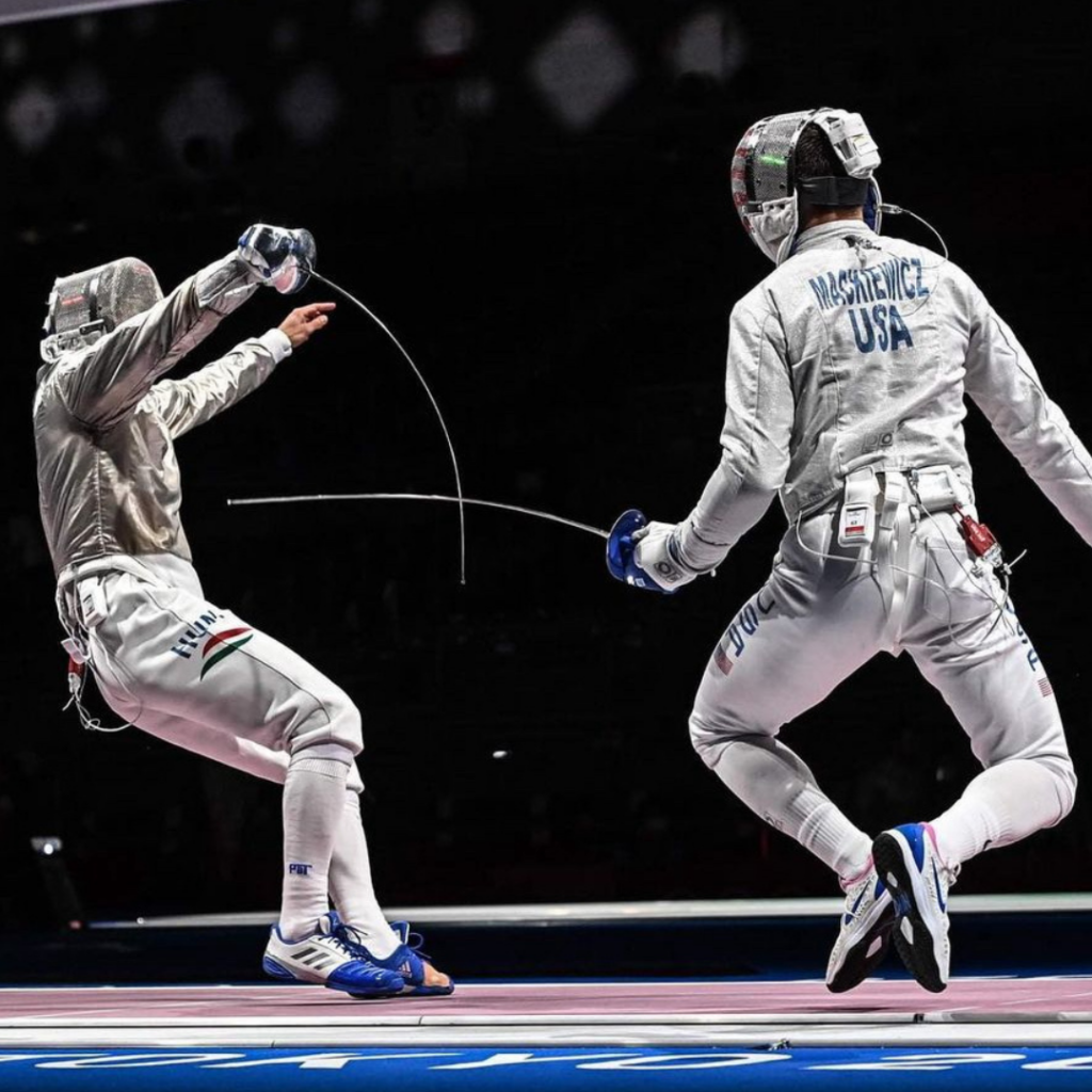 Photo of Andrew Mackiewicz during a fencing duel.