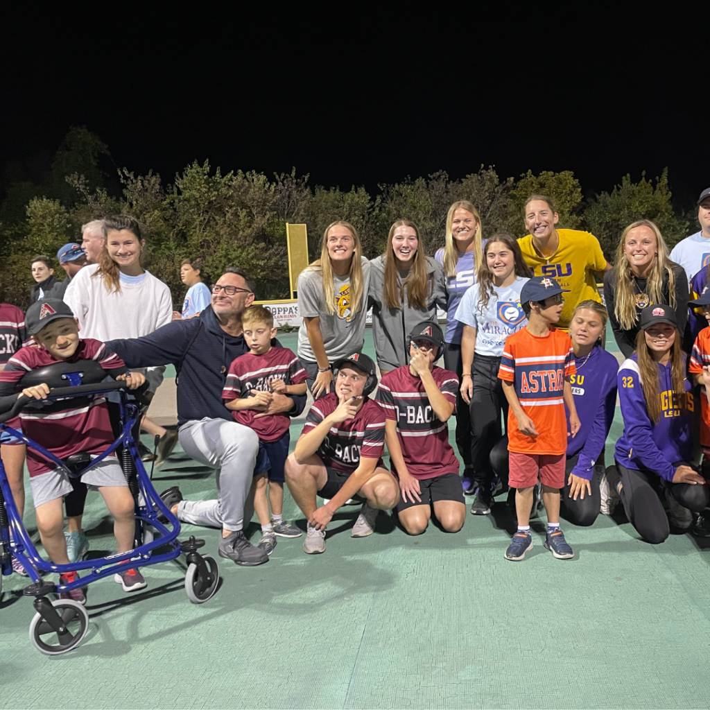 LSU softball poses for a photo with their new friends at the Miracle League.