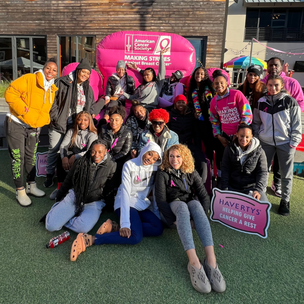 Bowie State women's basketball team poses for a photo before taking part in a breast cancer awareness walk.