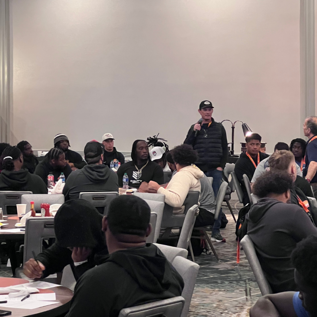 Jim Nagy giving Senior bowl players encouragement before they leave for their community service projects.