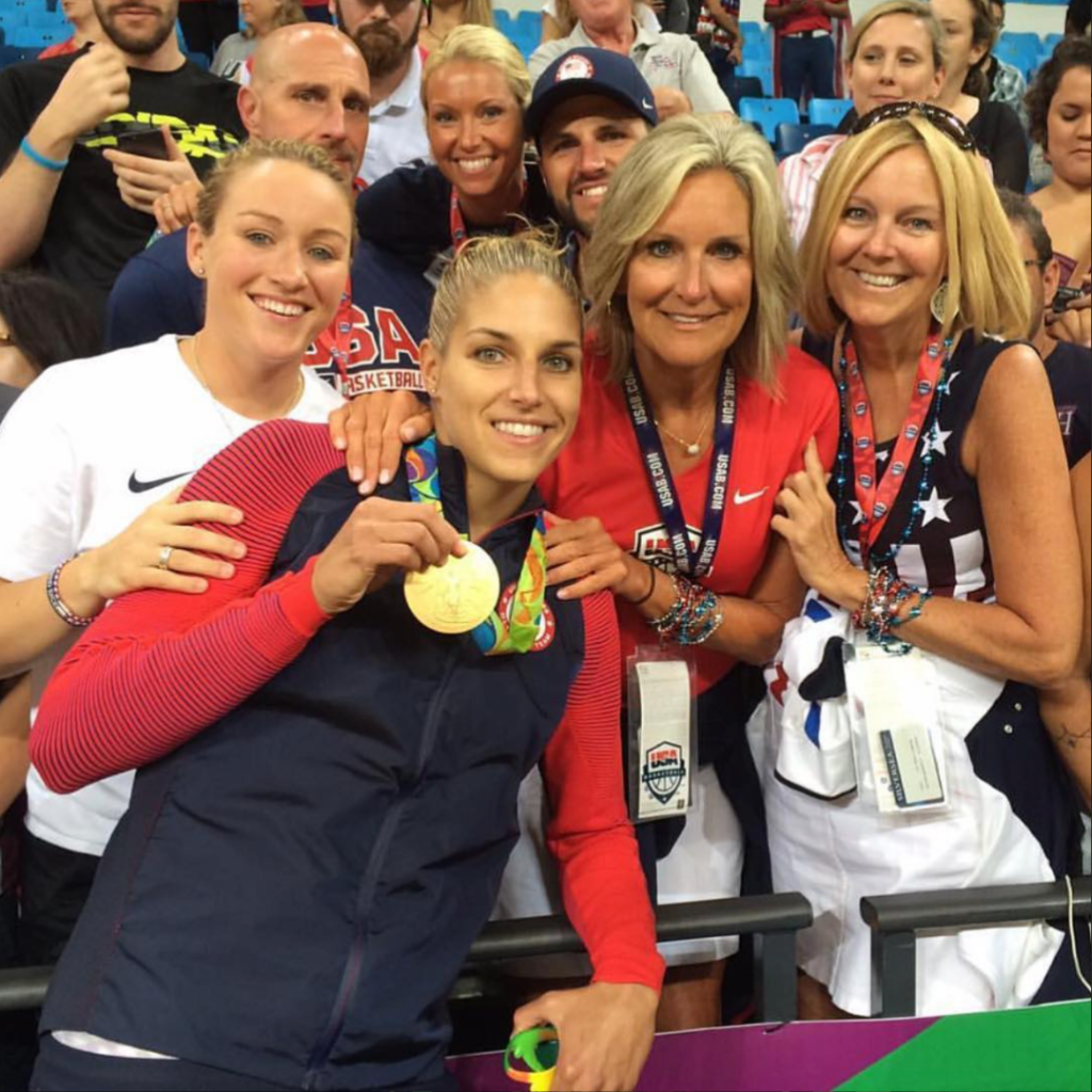 Elena Delle Donne smiles with family members as she shows off her Olympic Gold Medal.