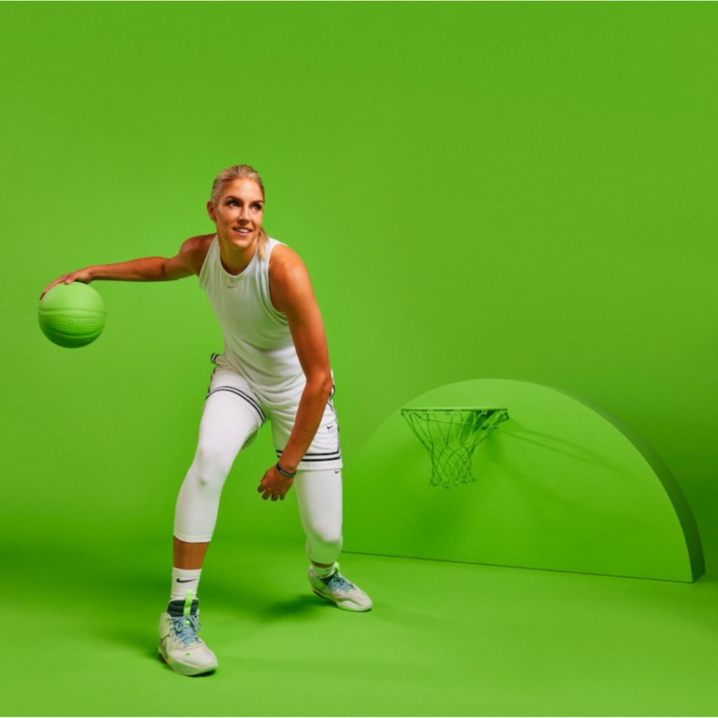 Elena Delle Donne dribbles a basketball in a lime green room