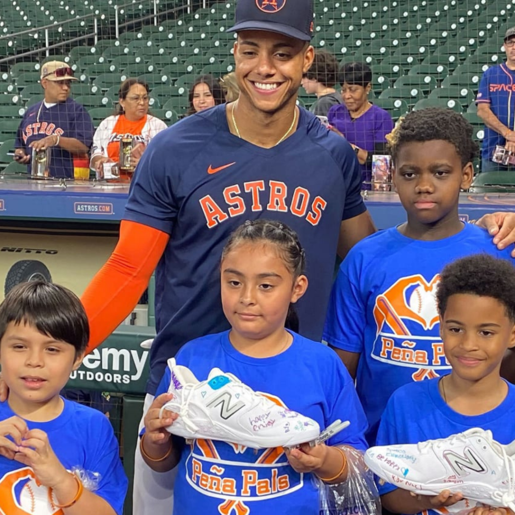 Jeremy Peña smiles with a group of his Peña Pals.